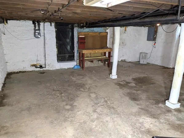 a view of a room with wooden walls