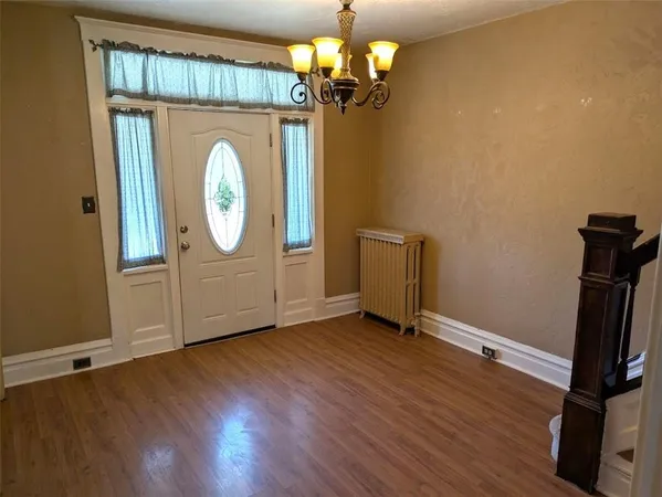a view of a livingroom with wooden floor