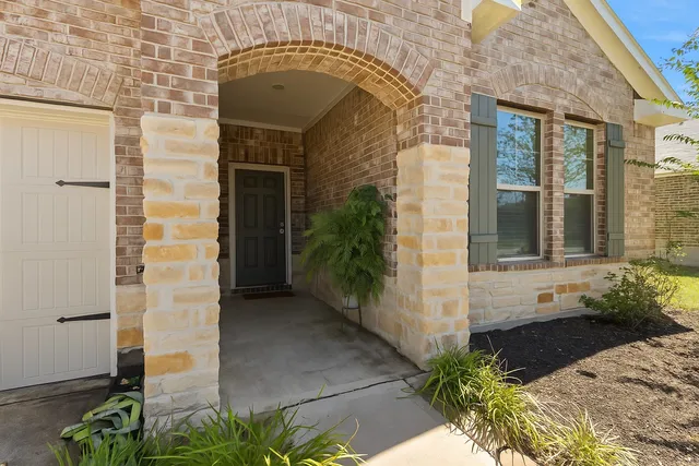 a front view of a house with a porch