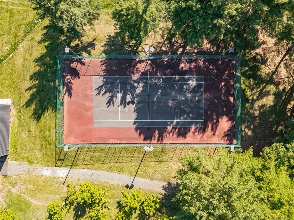 1506 Pleasant View Road Coopersburg, PA 18036 - Photo 95 of 97 An aerial perspective reveals a private tennis court nestled amongst verdant trees, ready for play.
