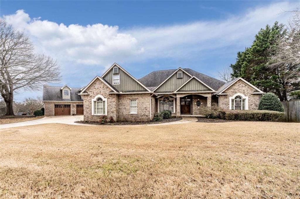 a view of house with yard and street view