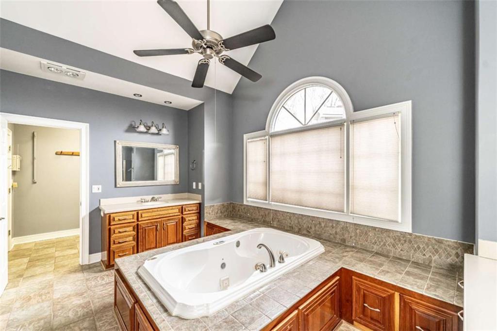 4 Bridgeview Drive Southeast Rome, GA 30161 - Photo 18 of 42 a bathroom with a sink a bathtub and a window