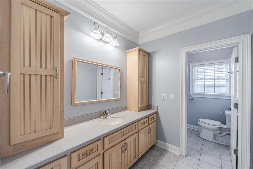 4 Bridgeview Drive Southeast Rome, GA 30161 - Photo 27 of 42 a bathroom with a double vanity sink a toilet and a mirror