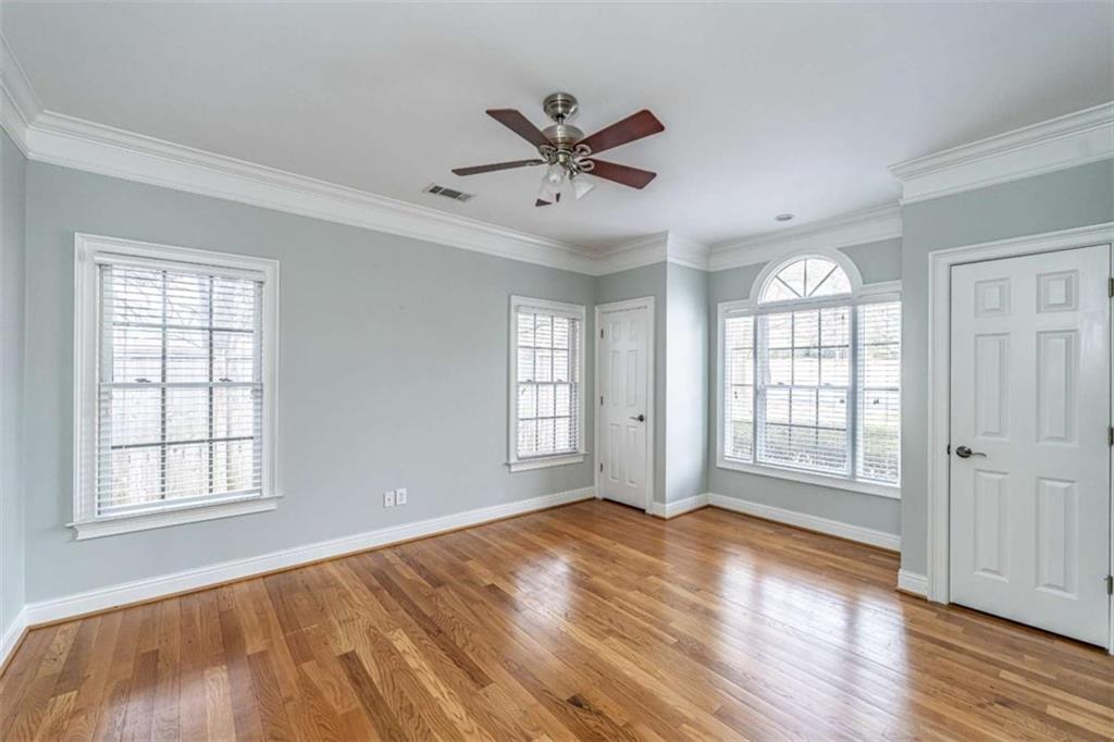 4 Bridgeview Drive Southeast Rome, GA 30161 - Photo 28 of 42 an empty room with wooden floor windows and ceiling fan