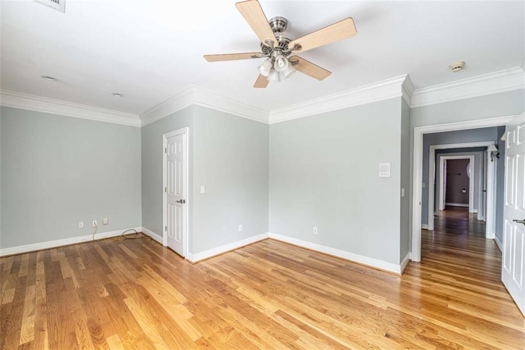4 Bridgeview Drive Southeast Rome, GA 30161 - Photo 33 of 42 a view of a room with wooden floor and a ceiling fan