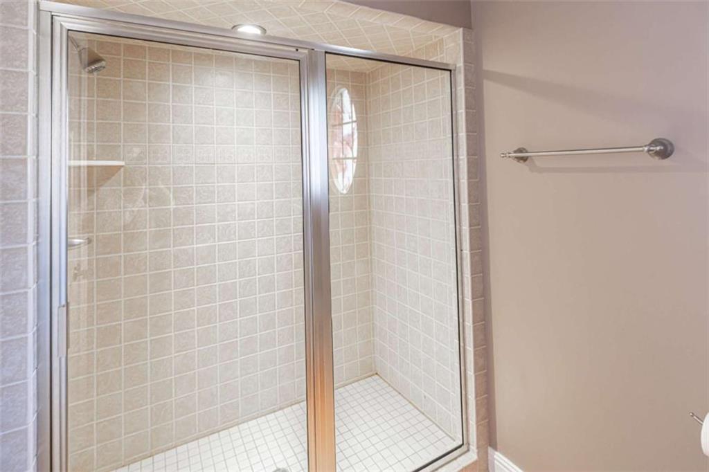 4 Bridgeview Drive Southeast Rome, GA 30161 - Photo 35 of 42 a bathroom with a glass shower door