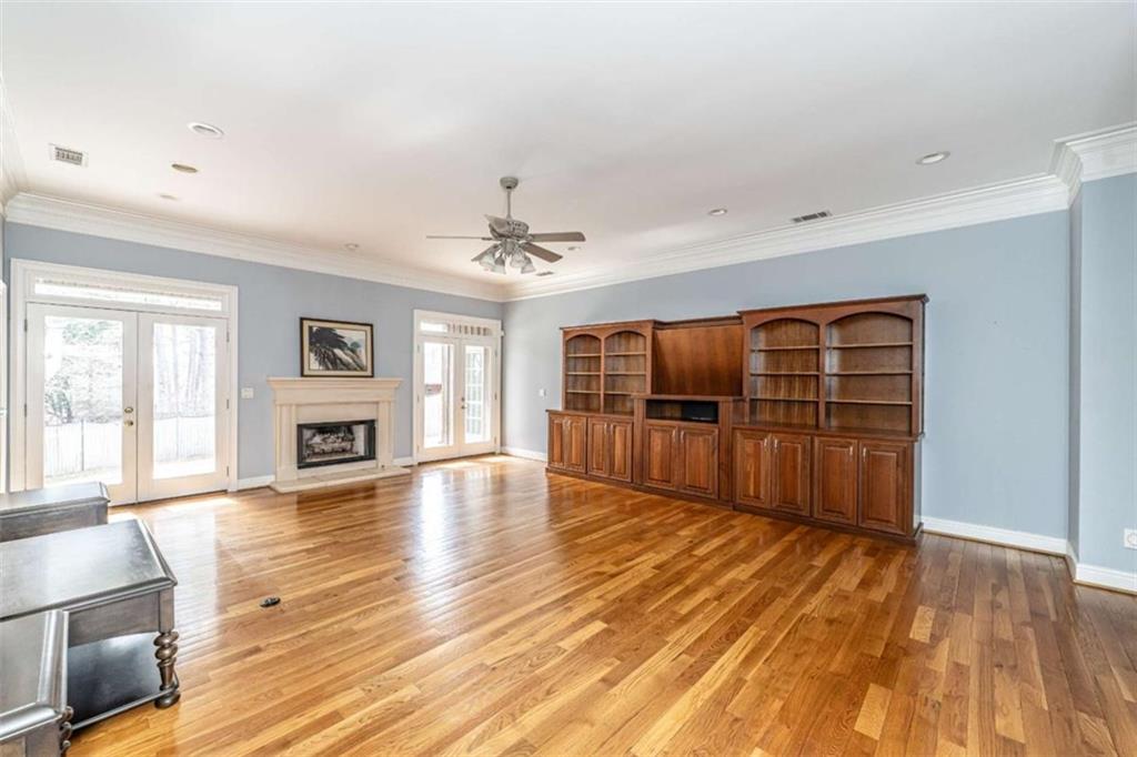 4 Bridgeview Drive Southeast Rome, GA 30161 - Photo 7 of 42 a view of an empty room with wooden floor and a window