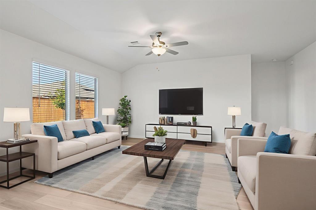 2203 Rannoch Street Sherman, TX 75092 - Photo 13 of 37 a living room with furniture and a flat screen tv