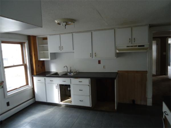 1271 Worcester Street Springfield, MA 01151 - Photo 11 of 16 a kitchen with stainless steel appliances granite countertop a stove a sink and a refrigerator