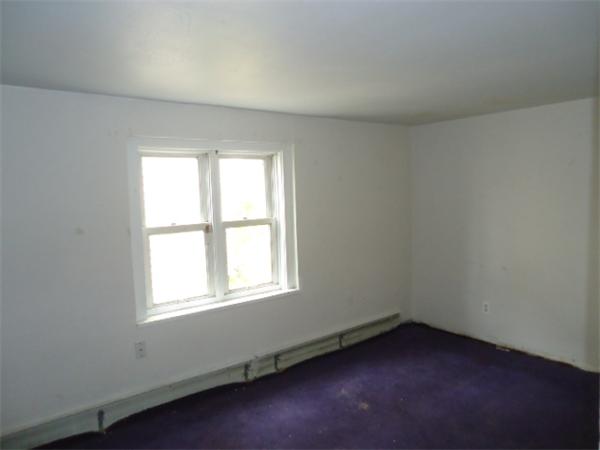1271 Worcester Street Springfield, MA 01151 - Photo 9 of 16 an empty room with a window