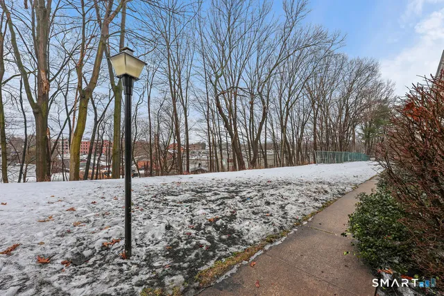 a view of a yard covered with snow