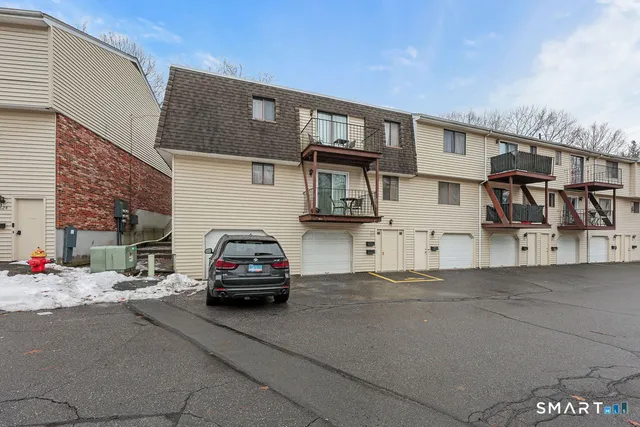 a car parked in front of a house