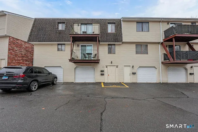 a view of a car park in front of house