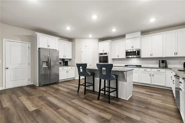 a large kitchen with cabinets