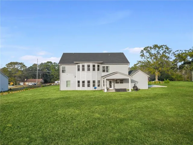 an aerial view of a garden with swimming pool