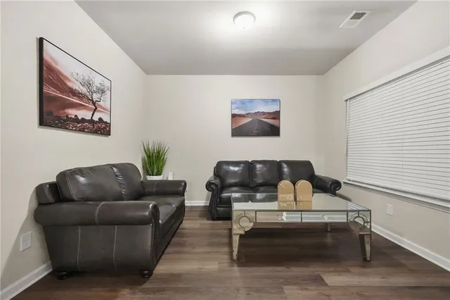 a view of a livingroom with furniture and window