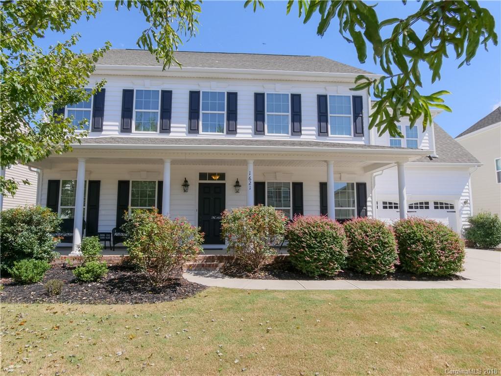 1621 Ridgehaven Road Waxhaw, NC 28173 - Photo 1 of 36 a front view of a house with lots of green space