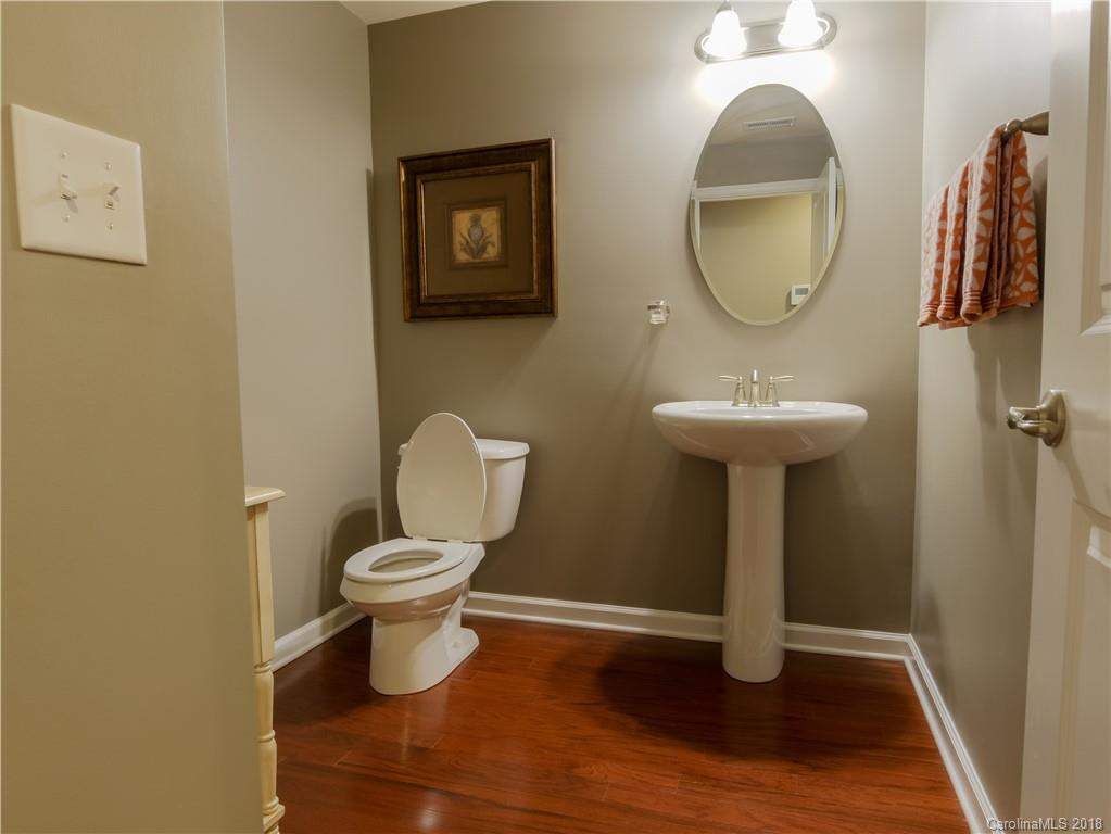 1621 Ridgehaven Road Waxhaw, NC 28173 - Photo 17 of 36 a bathroom with a toilet sink and mirror