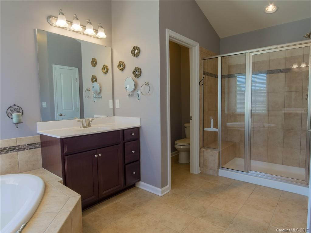 1621 Ridgehaven Road Waxhaw, NC 28173 - Photo 20 of 36 a bathroom with a sink double vanity and a shower