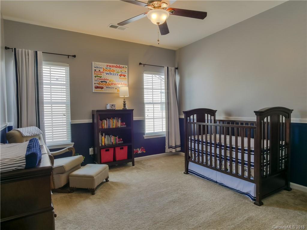 1621 Ridgehaven Road Waxhaw, NC 28173 - Photo 24 of 36 a bedroom with furniture and a window