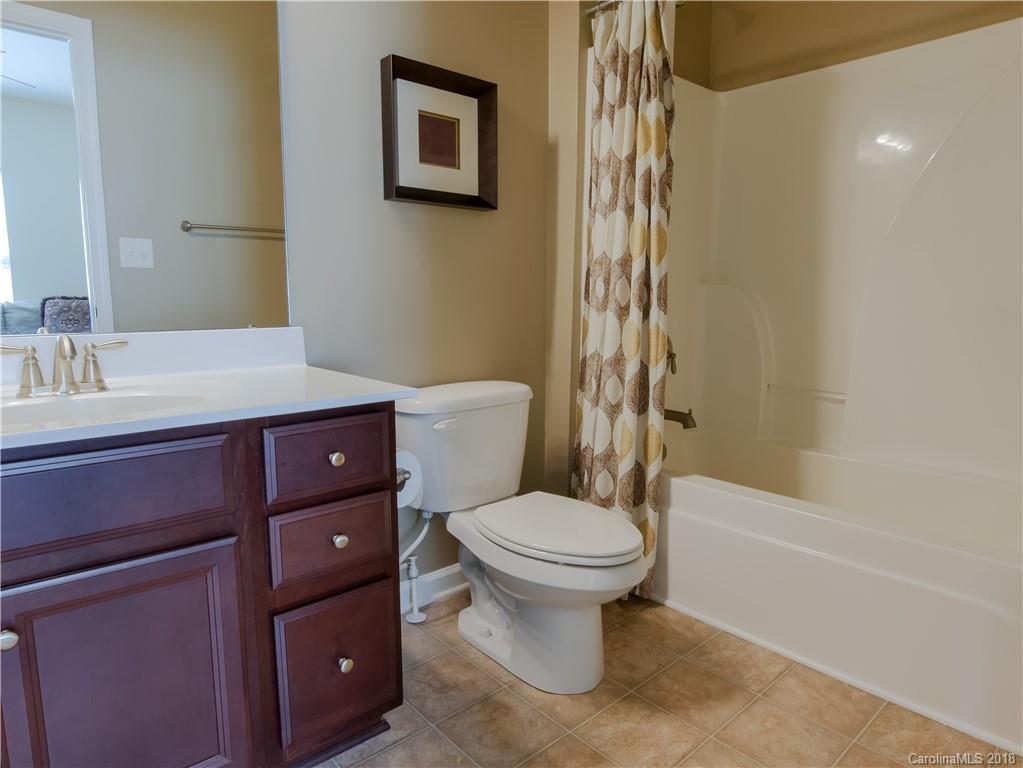 1621 Ridgehaven Road Waxhaw, NC 28173 - Photo 29 of 36 a bathroom with a sink a toilet and shower
