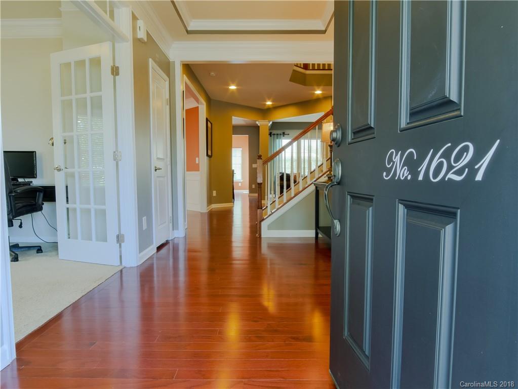 1621 Ridgehaven Road Waxhaw, NC 28173 - Photo 5 of 36 a hallway with wooden floor
