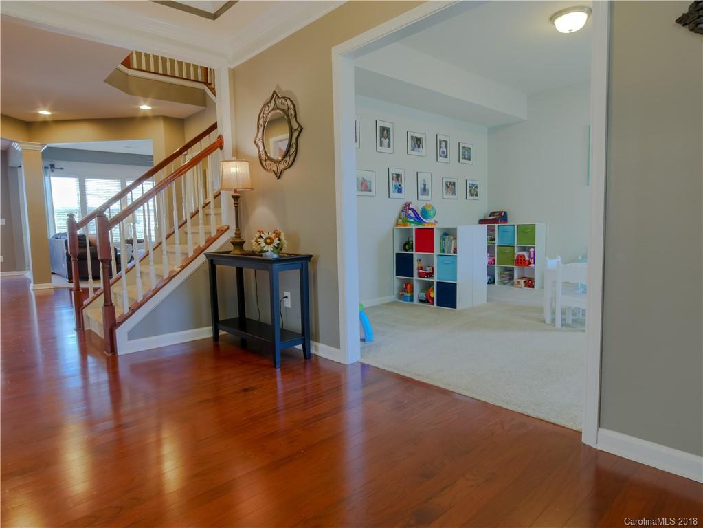 1621 Ridgehaven Road Waxhaw, NC 28173 - Photo 7 of 36 a hallway with wooden floor