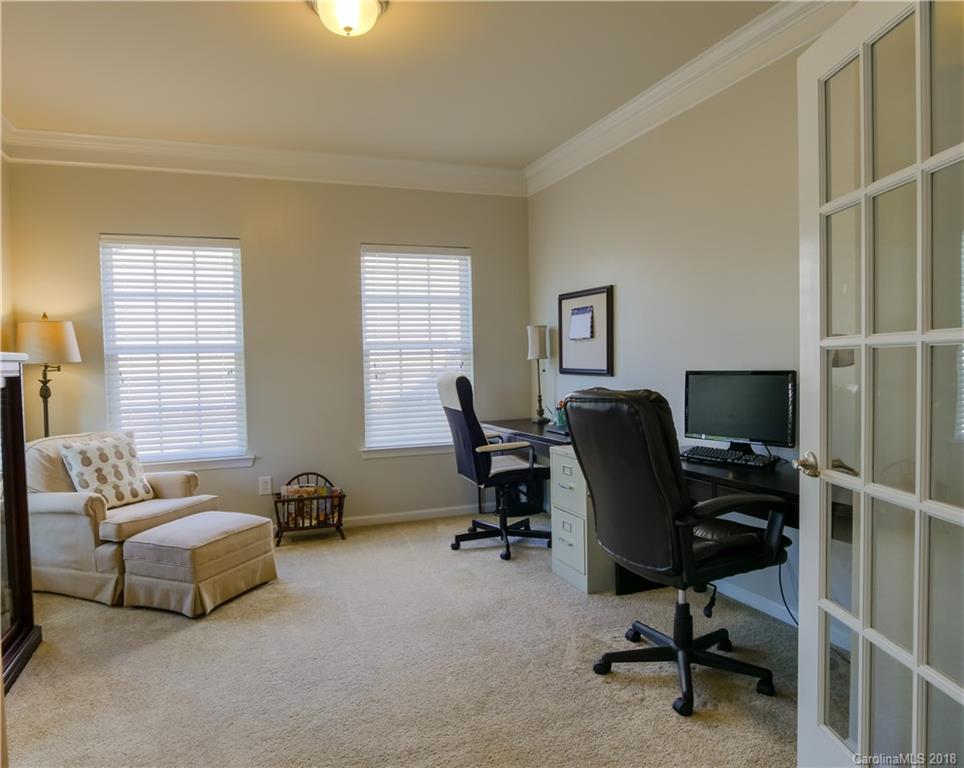 1621 Ridgehaven Road Waxhaw, NC 28173 - Photo 9 of 36 a view of a workspace with furniture and a window