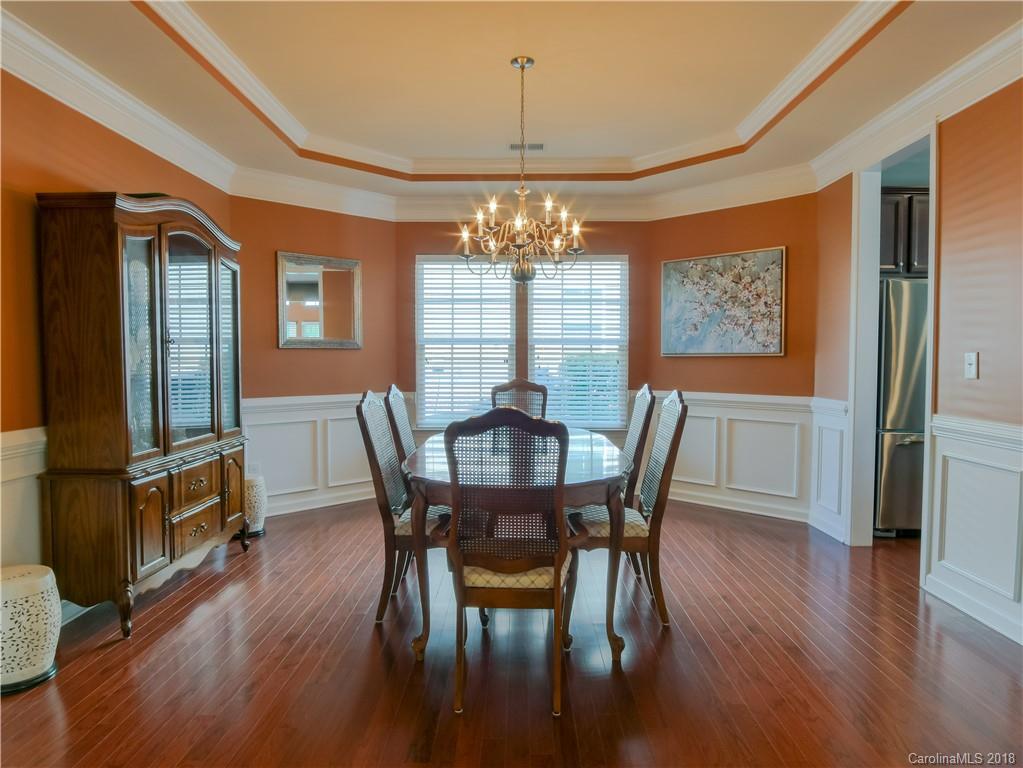 1621 Ridgehaven Road Waxhaw, NC 28173 - Photo 10 of 36 a view of a dining room with furniture window and wooden floor