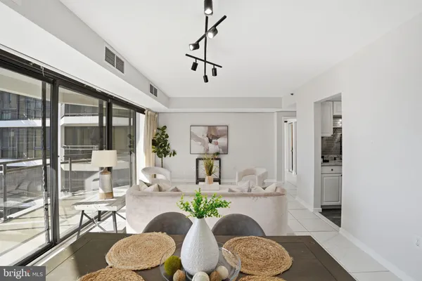 a living room with furniture and a table