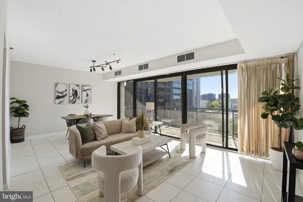 a living room with furniture and a large window
