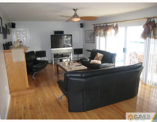 52 Eardley Road Edison, NJ 08817 - Photo 3 of 10 a living room with furniture and a flat screen tv