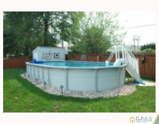 52 Eardley Road Edison, NJ 08817 - Photo 10 of 10 a view of a small house with a yard