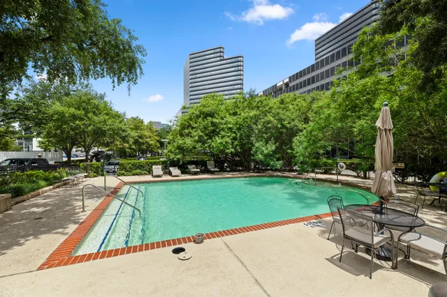 a view of a backyard with sitting area