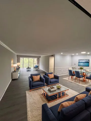 a living room with furniture and a table