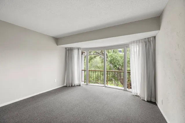 a view of a room with large windows