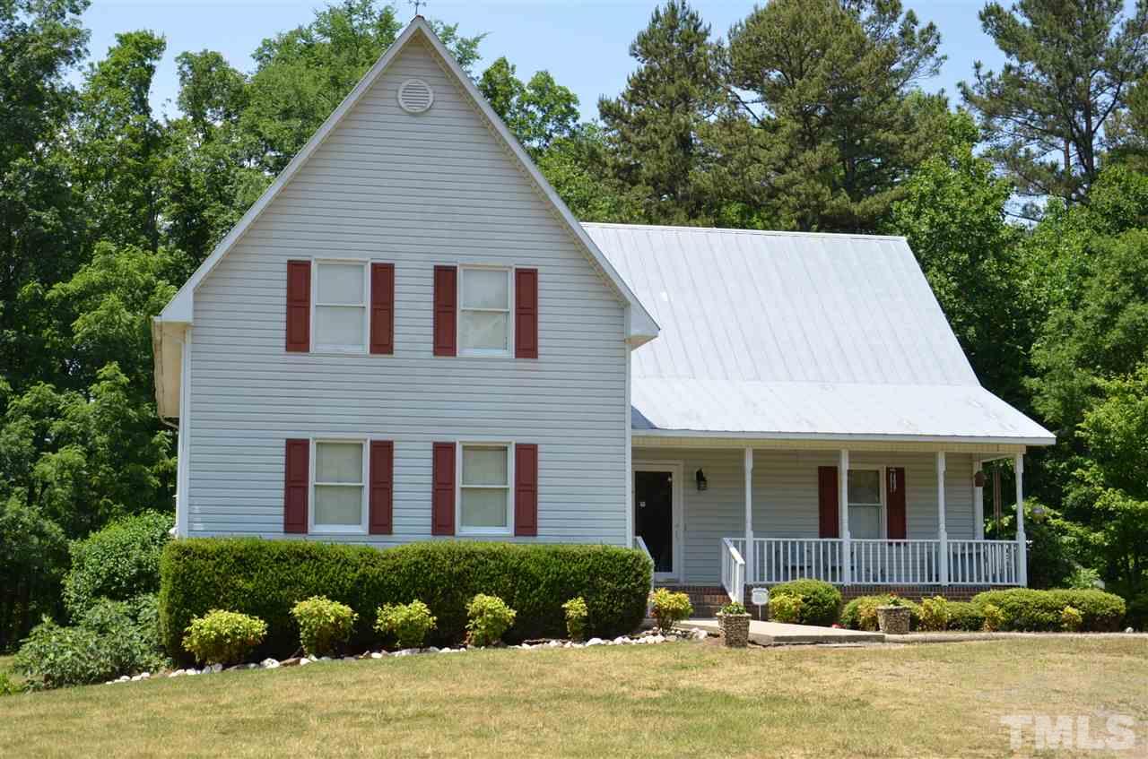 1000 Fate Washington Road Stem, NC 27581 - Photo 1 of 28 a front view of a house with a yard and potted plants