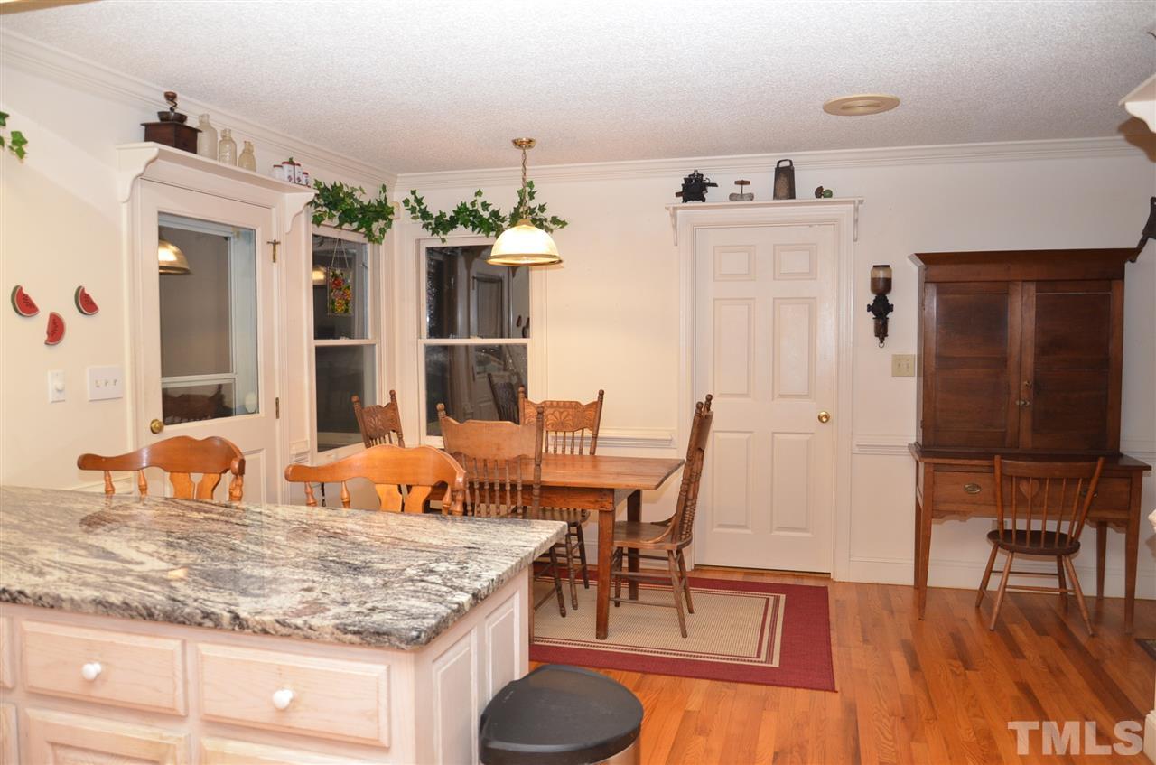 1000 Fate Washington Road Stem, NC 27581 - Photo 18 of 28 a dining room with furniture and wooden floor
