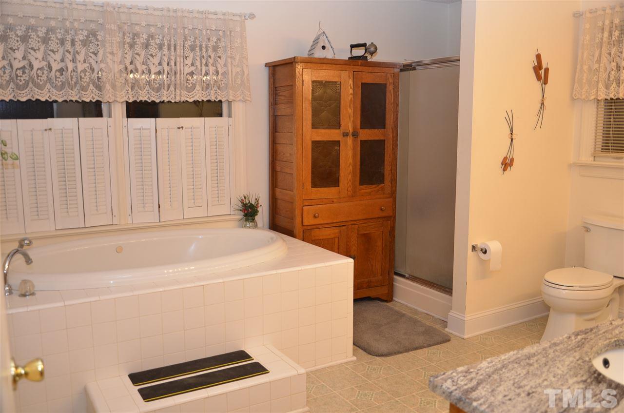1000 Fate Washington Road Stem, NC 27581 - Photo 20 of 28 a bathroom with a sink toilet and shower