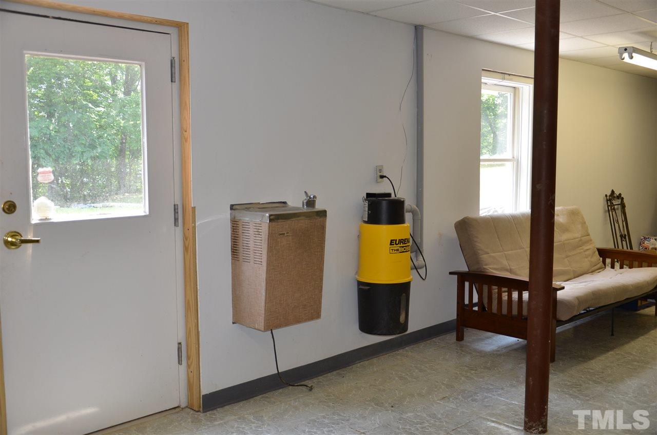 1000 Fate Washington Road Stem, NC 27581 - Photo 26 of 28 a view of a bedroom with furniture and a window