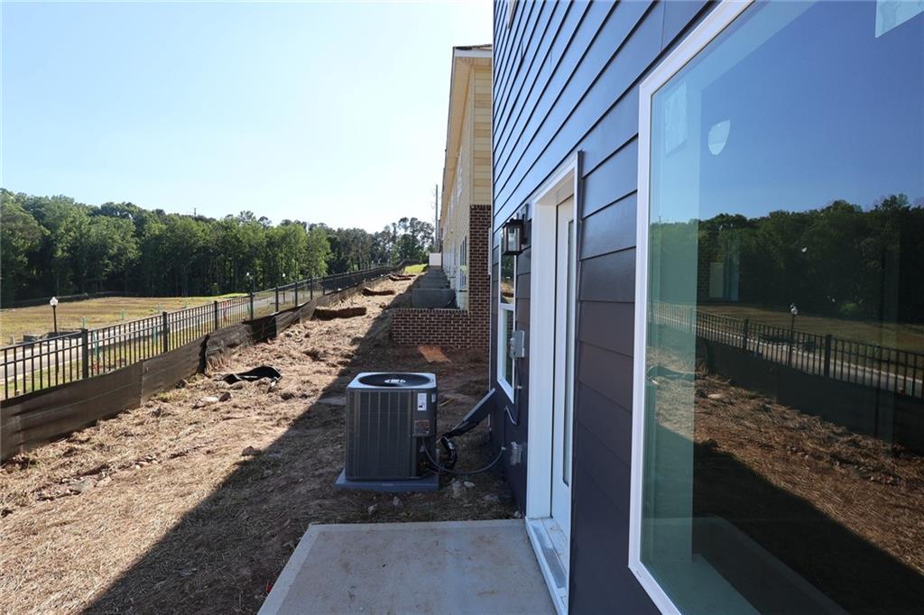 222 Redbud Road Canton, GA 30114 - Photo 3 of 10 a view of a balcony with chair and wooden floor