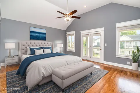 a spacious bedroom with a bed and window