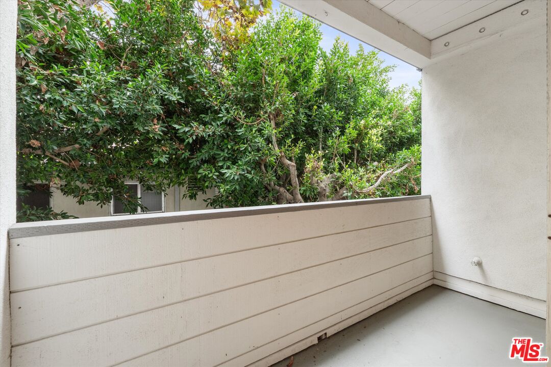 429 North Oakhurst Drive, Unit 203 Beverly Hills, CA 90210 - Photo 11 of 20 a view of a green field with trees in the background