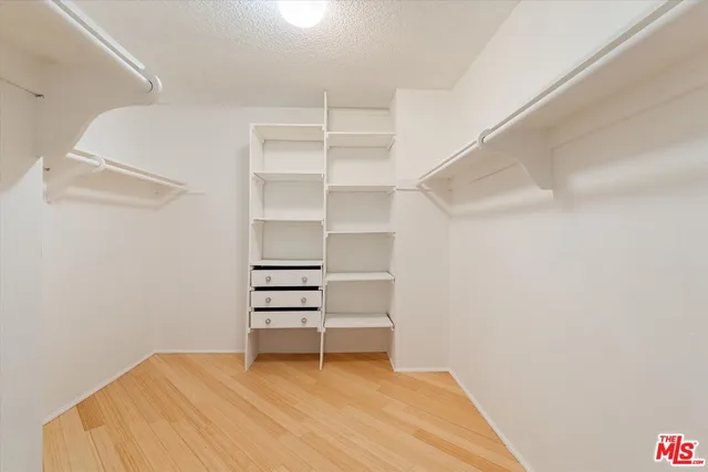 a view of room with racks on the wall