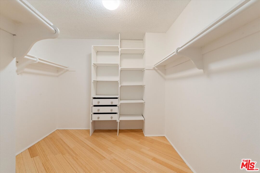 429 North Oakhurst Drive, Unit 203 Beverly Hills, CA 90210 - Photo 17 of 20 a view of room with racks on the wall