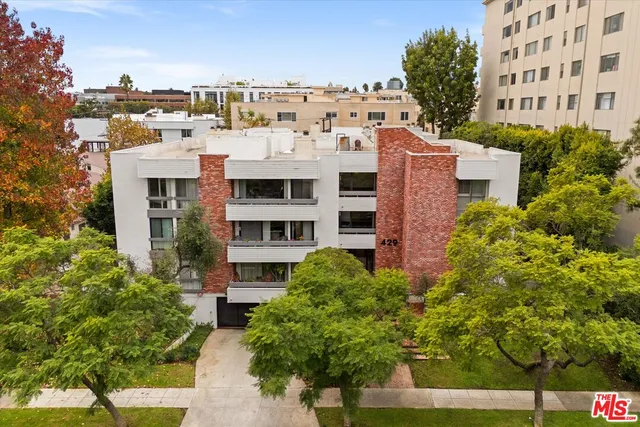 a large building with a tree in front of it