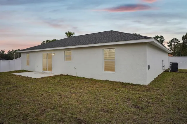 a view of a backyard of the house