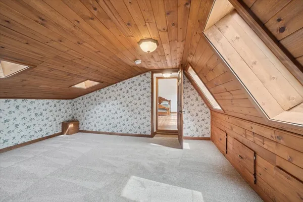 a view of a backyard with sitting area