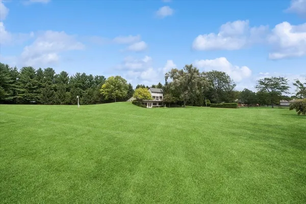 a backyard of a house with lots of green space