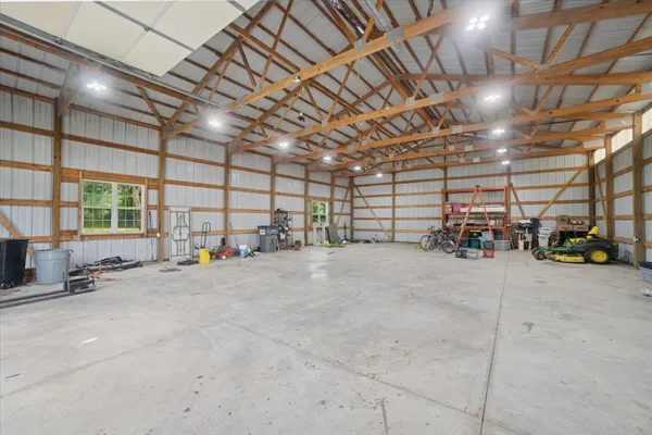 a view of empty room with wooden ceiling